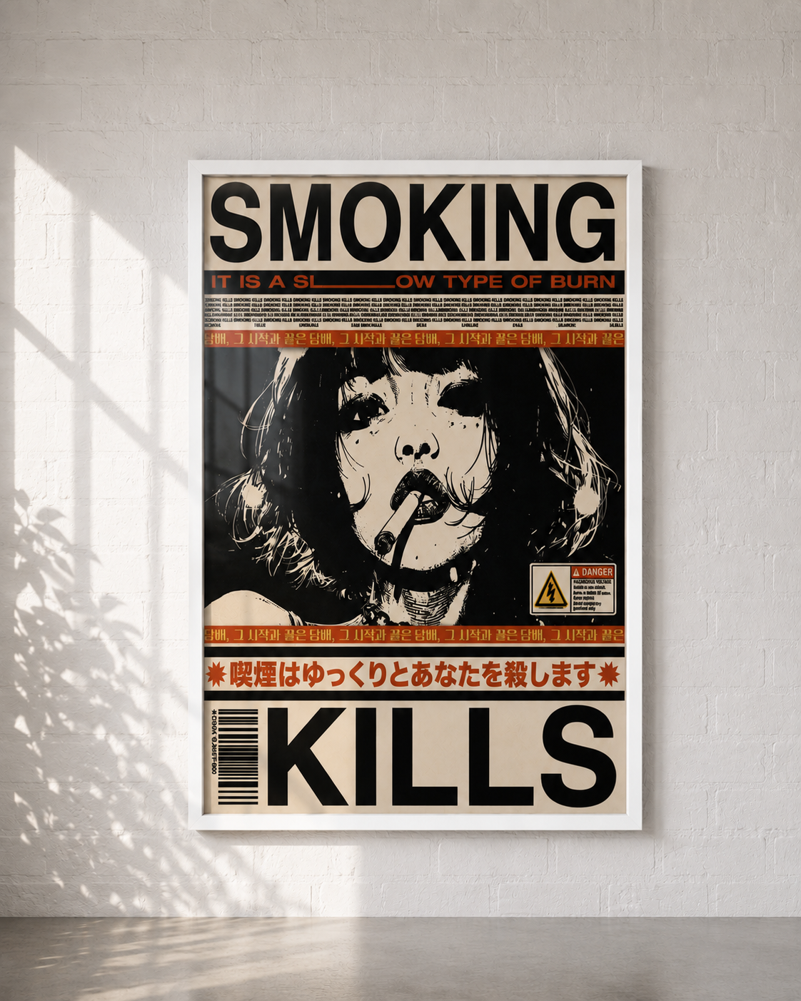 A framed poster with a high-contrast black, white, and orange graphic design featuring the word 'SMOKING' at the top and 'KILLS' at the bottom, displayed on a white wall with soft window shadows.